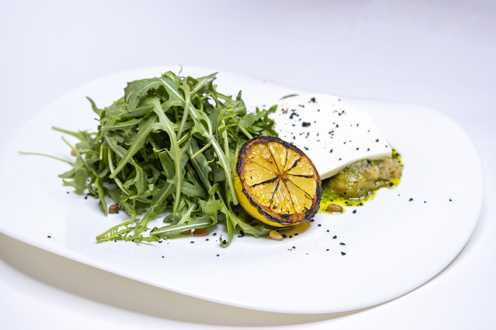 Plated seasonal salad with citrus and herbs